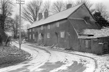 Astley.  Post Office and cottages under snow