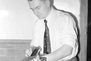 Nuneaton.  John Deeming, cleaning his boots