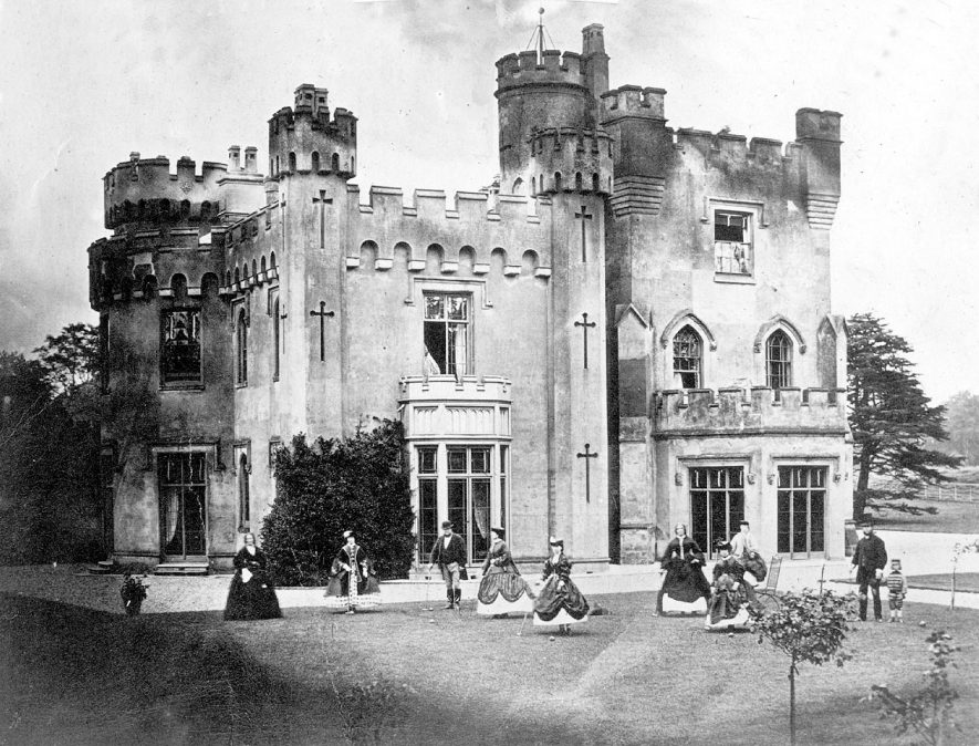 Weddington Hall/Castle, stood at what is now the junction of Shawe Avenue and Castle Road.   The family are playing croquet on the lawn.  1860s |  IMAGE LOCATION: (Nuneaton Library)