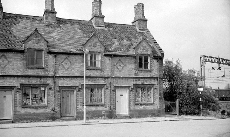 Cottages in Wheat Street, Nuneaton, just prior to their demolition. Railway gantry in background. April 26th 1964 |  IMAGE LOCATION: (Warwickshire County Record Office)