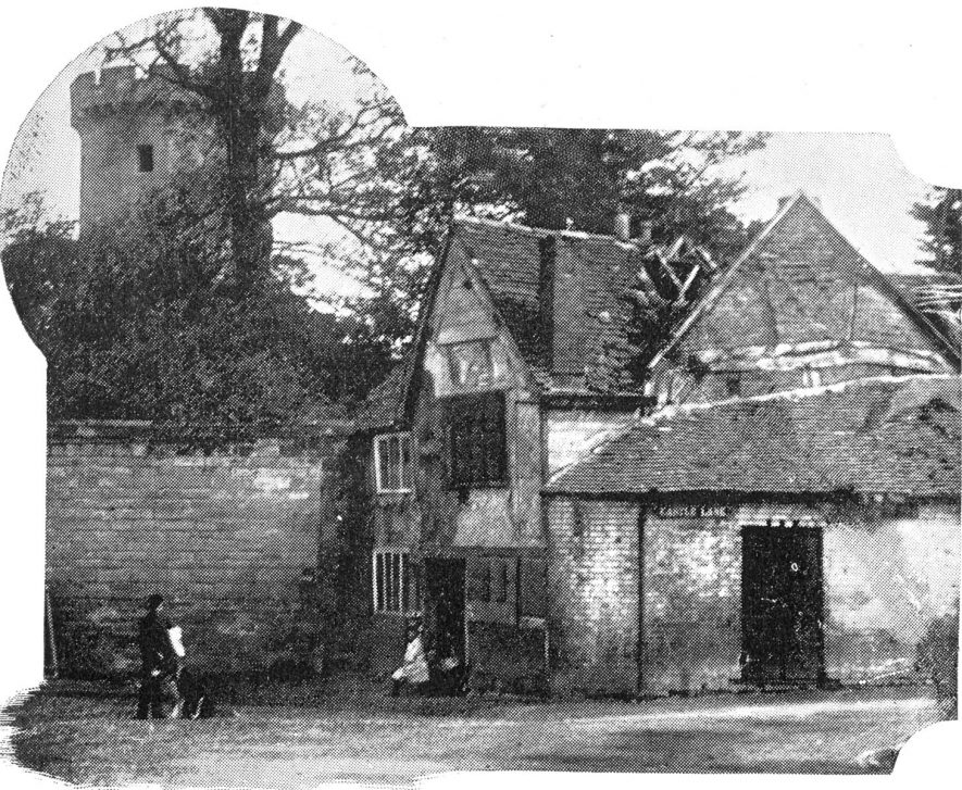 Cottages under the castle wall at the turn of the 20th century.  1905 |  IMAGE LOCATION: (Warwickshire County Record Office)