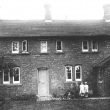 Hunningham.  Children outside a house