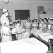 Leamington Spa.  Nurses learning baby-feeding