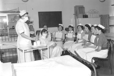 Leamington Spa.  Nurses learning baby-feeding