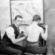Leamington Spa.  Tattooist at work