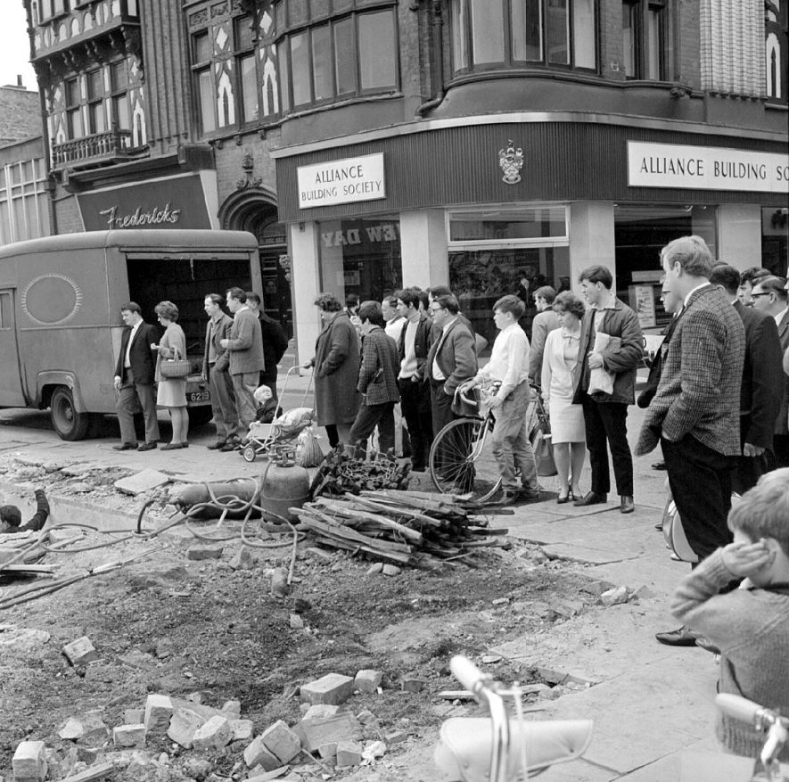 Group of people watching demolition work in Newdegate street, Nuneaton.  June 3rd 1967 |  IMAGE LOCATION: (Warwickshire County Record Office)