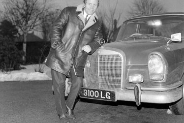 Nuneaton.  Alan Randall standing beside his Mercedes