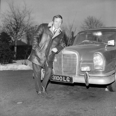 Nuneaton.  Alan Randall standing beside his Mercedes