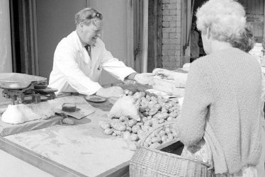 Nuneaton.  Frank Smith working in Clarke's vegetable shop