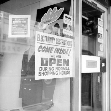 Nuneaton.  Power cut notice in shop window