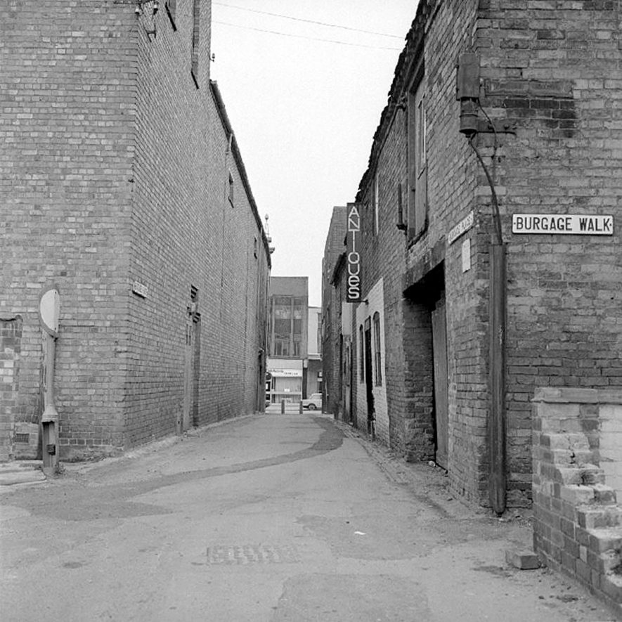 View along Burgage Place towards Abbey Street, Nuneaton, with the Scala cinema building on the left.  9 April 1978 |  IMAGE LOCATION: (Warwickshire County Record Office)