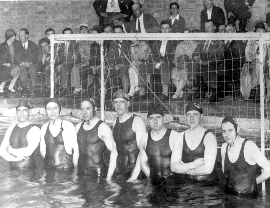 Leamington Spa water polo team just before their game with Weston-super-Mare at the baths in Leamington. Team left to right - Val Clarke, Nobby Cole, Ken Swain, Stan Burte, Ray Baker, Bill Robinson, Frank Treppass (Capt.).  1926 |  IMAGE LOCATION: (Leamington Library) PEOPLE IN PHOTO: Treppass, Frank, Swain, Ken, Robinson, Bill, Cole, Nobby, Clarke, Mr Val, Burte, Stan, Baker, Ray