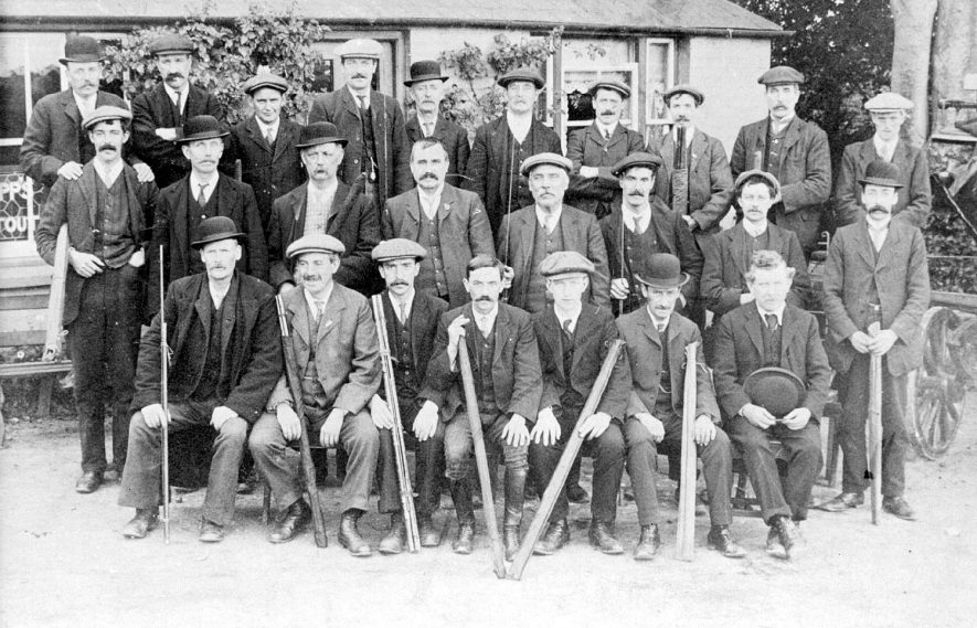 Outing from the Talbot Inn, Rushmore Street, to the White Lion, Radford in the 1920s.                                                                                                                                      Top row: 3rd from left:  Midge Hughes.  2nd from  right: Albert Brookes                    Middle Row: 3rd from right: Mr White, 5th form right: Mr Barnwell                               Bottom Row: left: Harry Robbins, right: Mr Rowbottom |  IMAGE LOCATION: (Leamington Library) PEOPLE IN PHOTO: White as a surname, Rowbottom as a surname, Robbins, Harry, Hughes, Midge, Brooks, Albert, Barnwell as a surname