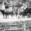 Charlecote.  Tally Ho coach outside Charlecote Park gates