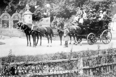 Charlecote.  Tally Ho coach outside Charlecote Park gates