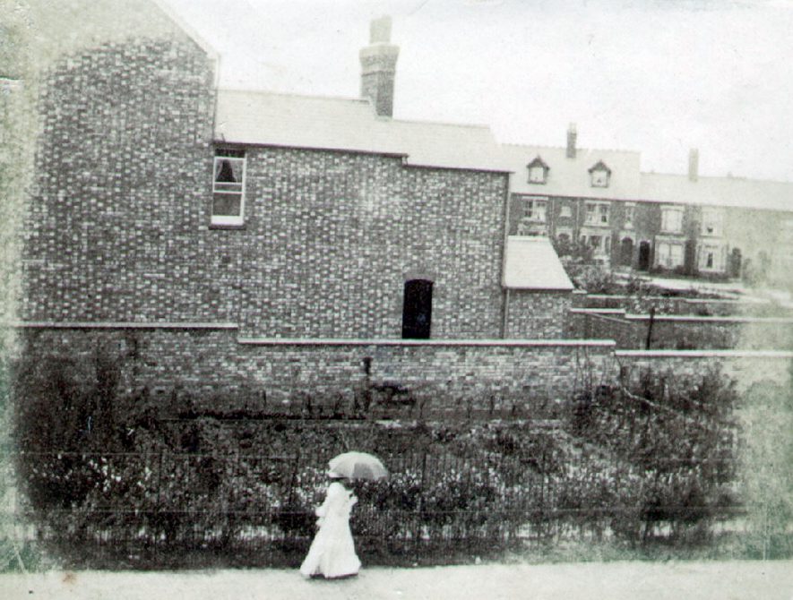 Clifton Road, Rugby.  Woman passing by side of house.  1898 |  IMAGE LOCATION: (Rugby Library)