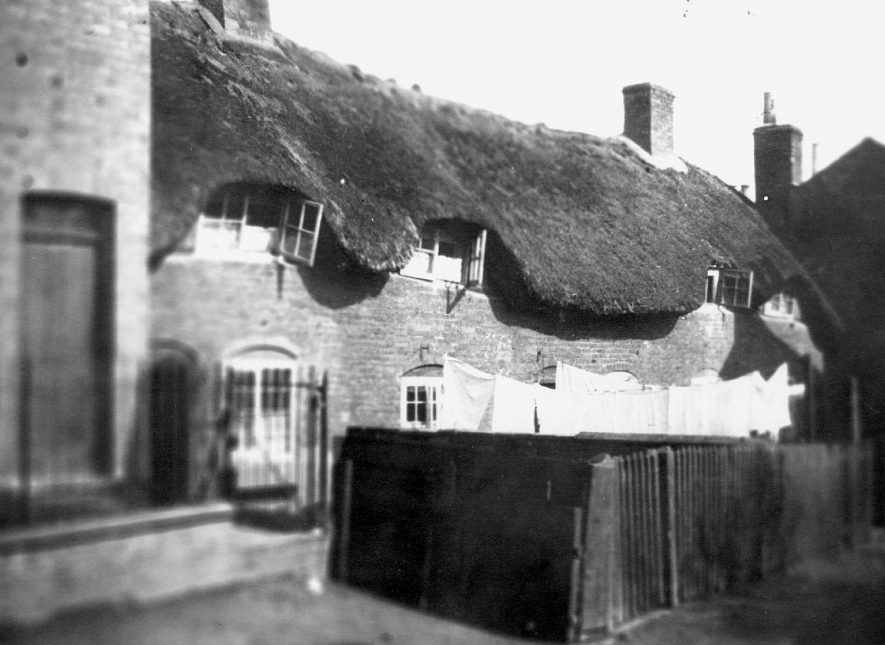 Nos. 7 - 11, Pinders Lane, at the top of the hill, Rugby.  These cottages were demolished in the 1930s.  1896 |  IMAGE LOCATION: (Rugby Library)