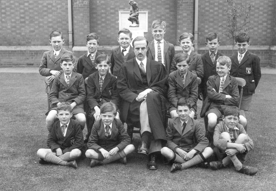 A form with Mr A C Kemp, the formmaster, at Lawrence Sheriff School, Rugby.  1938 |  IMAGE LOCATION: (Rugby Library) PEOPLE IN PHOTO: Kemp as a surname, Kemp, Mr H C