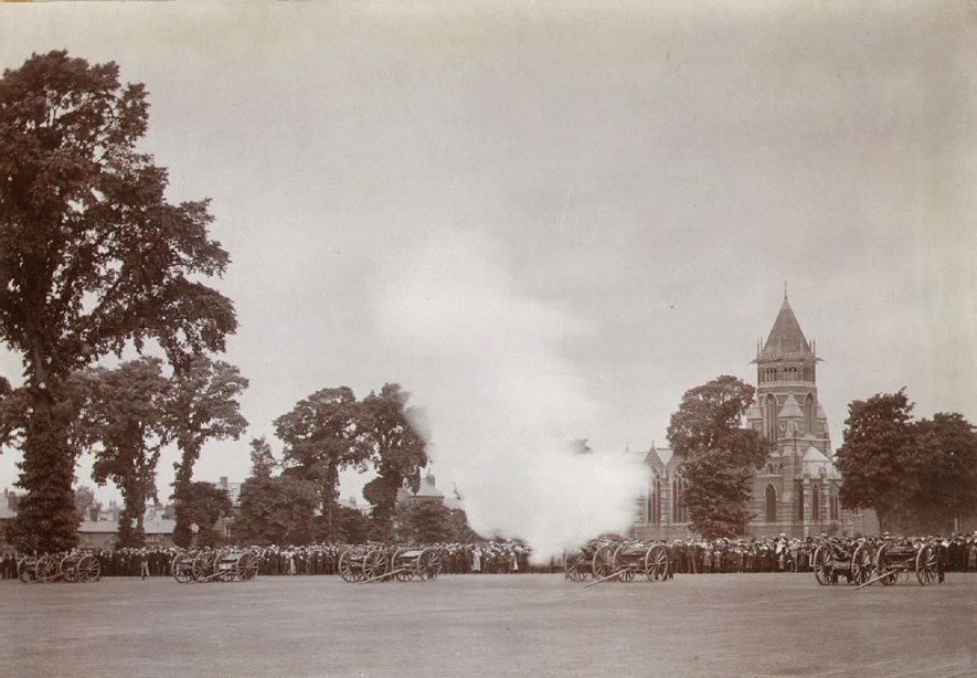 Crowd watching the firing of the Royal Salute by the Howitzer Battery in Rugby School Close during the coronation celebrations of King George V.  June 22nd 1922 |  IMAGE LOCATION: (Rugby Library)