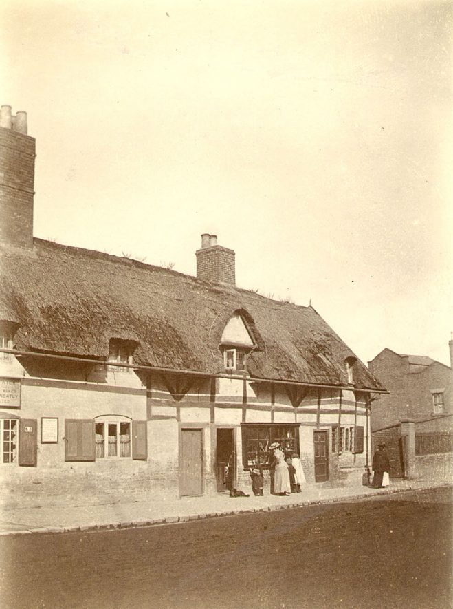 Thatched cottages in North Street, Rugby, which were demolished in 1933.  1910s |  IMAGE LOCATION: (Rugby Library)