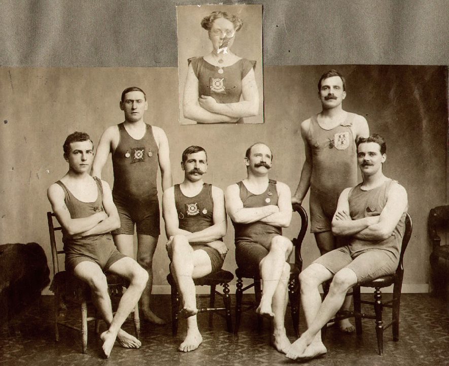 Rugby Swimming and Life Saving Society members who were the winners of the Award of Merit in 1912.
Standing - F.G Wroot, W.J Verrier.
Seated, left to right - F.C Shillitoe, S. Smithies, W.J Rouse, W.P Cowley.
Inset - Mrs E Smithies. |  IMAGE LOCATION: (Rugby Library) PEOPLE IN PHOTO: Wroot, F G, Wroot as a surname, Verrier, W J, Verrier as a surname, Smithies, S, Smithies, Mrs E, Smithies as a surname, Shillitoe, F C, Shillitoe as a surname, Rouse, W J, Rouse as a surname, Cowley, W P, Cowley as a surname
