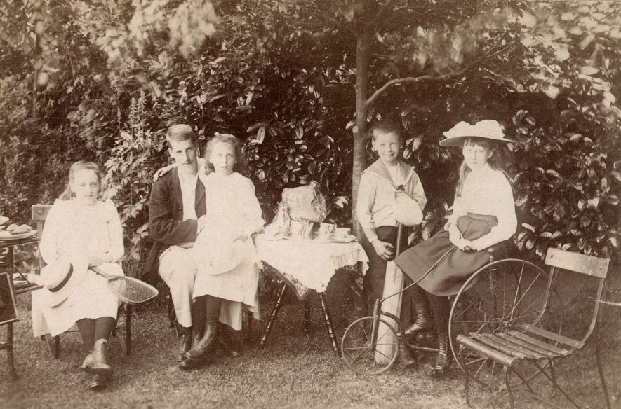 Mr William Dewar with his children in the garden of 