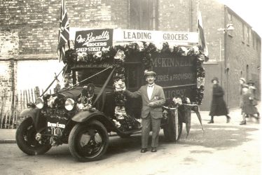 Rugby.  J. J. McKinnell's decorated grocery van