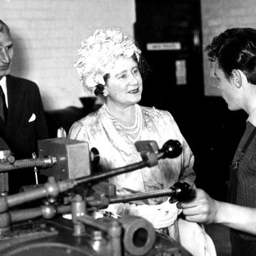 Her Majesty Queen Elizabeth the Queen Mother at the A.E.I. works, Rugby.  She is accompanied by Mr D.G Craddock, Superintendent of the apprentices training department.  July 5th 1961 |  IMAGE LOCATION: (Rugby Library) PEOPLE IN PHOTO: Elizabeth, The Queen Mother, Craddock, Mr D G, Craddock as a surname
