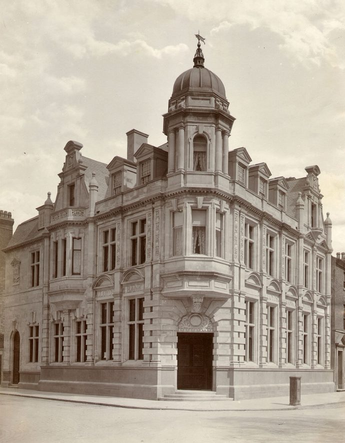 Lloyd's Bank in Church Street, Rugby. This building was opened in 1903. From 1840 until 1903 the business was carried on in a house in Church Street which had previously been a Rugby School boarding house. From circa 1794 - 6 until 1840 the business was carried on in an alcove of the drapery establishment of Mrs Ann Butlin, who had purchased the Rugby Bank from Mr Samuel Clay. This bank was incorporated with Lloyd's Banking Co. in 1868.  1900s
See - Treen - Records of Old Rugby and Rugby Advertiser, 1903. |  IMAGE LOCATION: (Rugby Library)