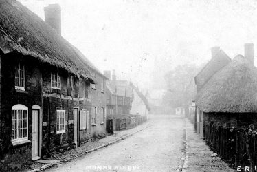 Monks Kirby.  Village street and thatched cottages