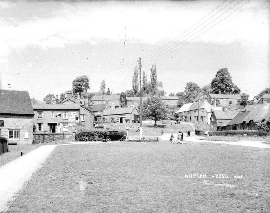 Village centre and grocers shop, Napton on the Hill.  1950s    [View looking up The Green, High St.towards one of the shops/Post Office. Property on the far left is the former Plough & Harrow public house, now a private residence.] |  IMAGE LOCATION: (Warwickshire County Record Office)