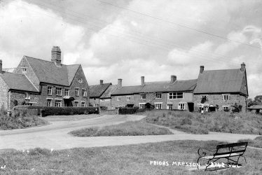 Priors Marston.  Road junction and cottages