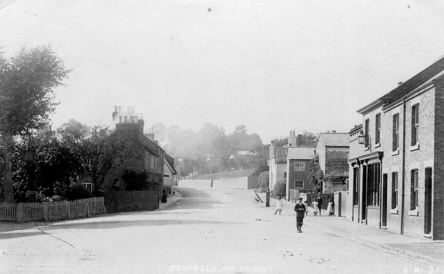 Newbold on Avon, probably the main street.  1900s
[This is Main Street, looking towards St Botophs Church from the Brownsover Road, Parkfield Road, Crossroads. The two houses on the right is where employees of the Cooperative Society lived, and the shop is the Newbold Co-op.] |  IMAGE LOCATION: (Warwickshire County Record Office)