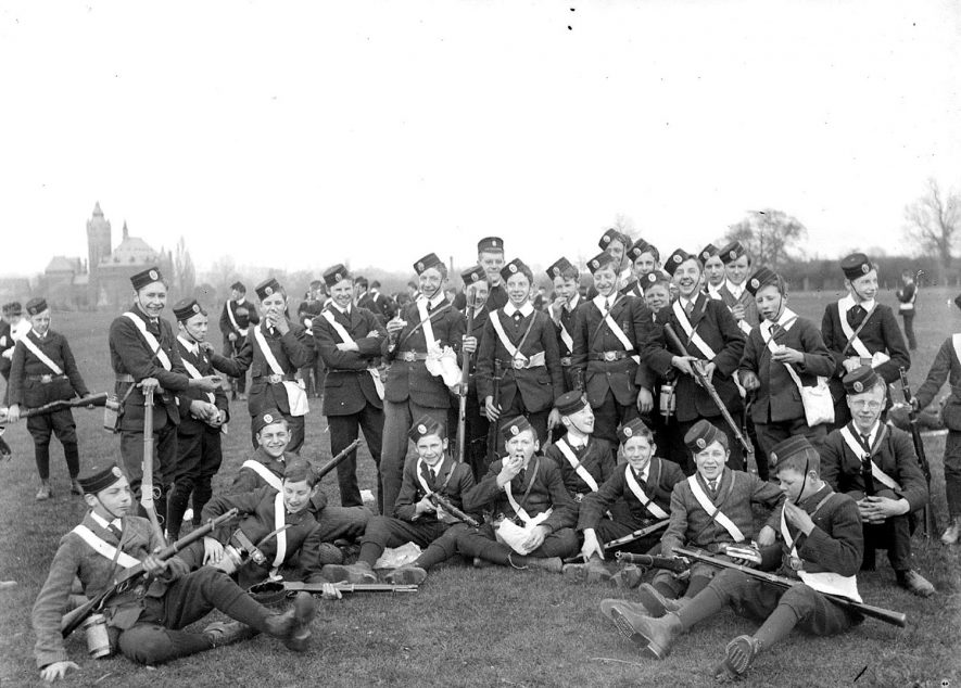 A group of members of the Church Lads' Brigade, several carrying rifles, in Stratford upon Avon. 1920s[The Church Lads' Brigade was formed in 1881 and was specifically for the Anglican Church. Today it has combined with girls to form the Church Lads' and Church Girls' Brigade] |  IMAGE LOCATION: (Warwickshire County Record Office)