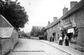 Station Road (now Main Street), Wolston, with Lissaman's drapers shop and the Oddfellows Hall.  1900s |  IMAGE LOCATION: (Warwickshire County Record Office)