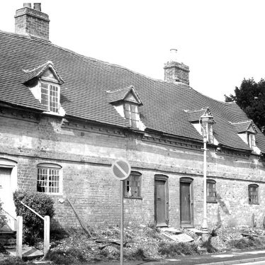Almshouses in Alcester.  1940s [This picture may have been taken in the late 1960s and not as shown 1940s, because of the broken windows. This photograph is of the Priory Almhouses on Birmingham Road (founded in 1659).] |  IMAGE LOCATION: (Warwickshire County Record Office)