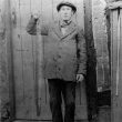 Broom.  William King holding a large eel