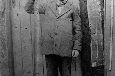 Broom.  William King holding a large eel