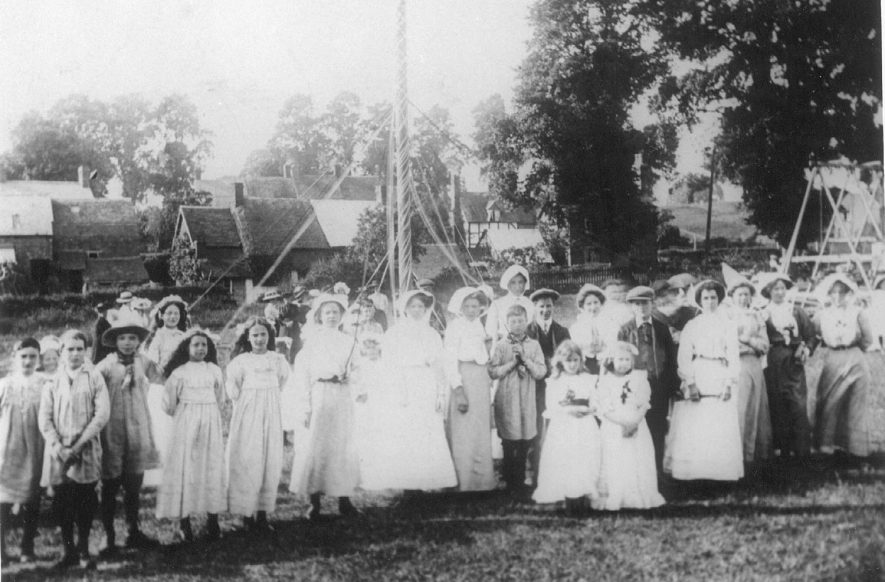 May Day celebrations, showing children around the maypole in Ashorne.  1910s |  IMAGE LOCATION: (Warwickshire County Record Office)