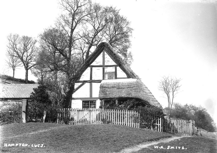 A timber framed thatched cottage in Hampton Lucy.  1900s |  IMAGE LOCATION: (Warwickshire County Record Office)