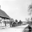 Hampton Lucy.  Thatched timbered cottage