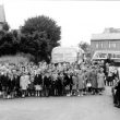 Cubbington.  Group of schoolchildren with coaches