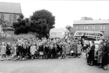 Cubbington.  Group of schoolchildren with coaches