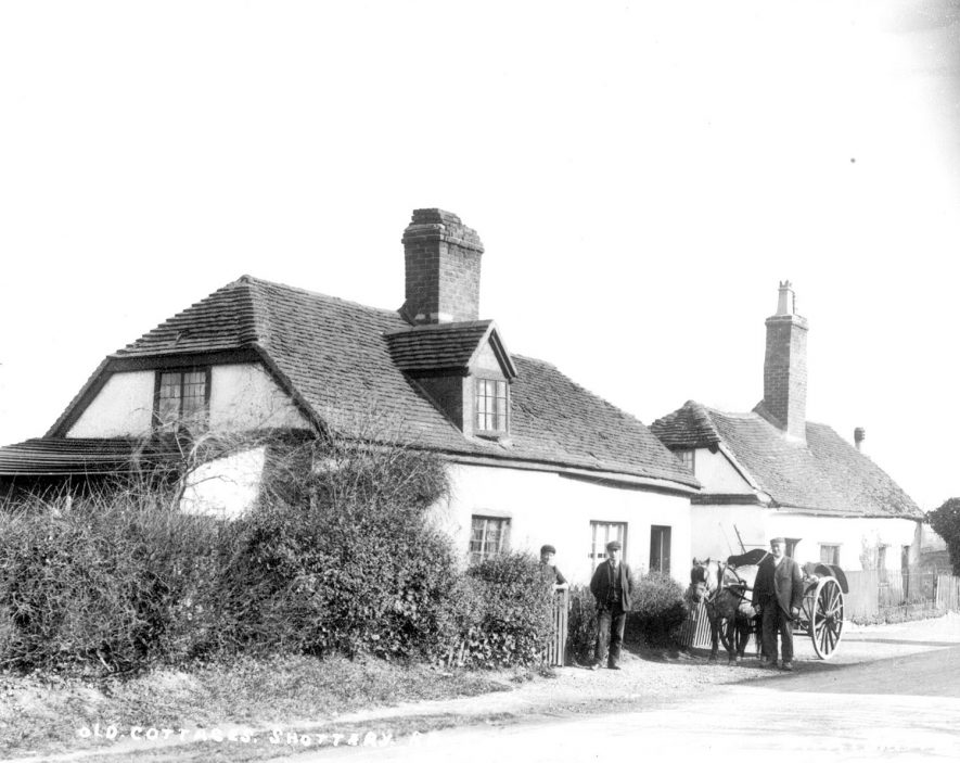 Cottages in Shottery Road, Stratford upon Avon. Standing in front are three men with a horse and cart.  1900s |  IMAGE LOCATION: (Warwickshire County Record Office)