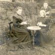 Stoneleigh.  Three people in garden