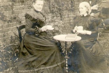Stoneleigh.  Three people in garden