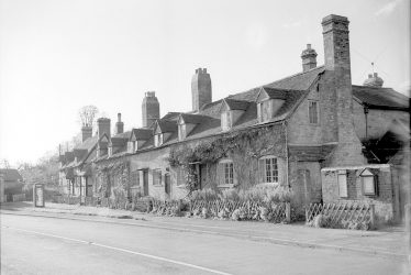 Arrow.  A row of cottages