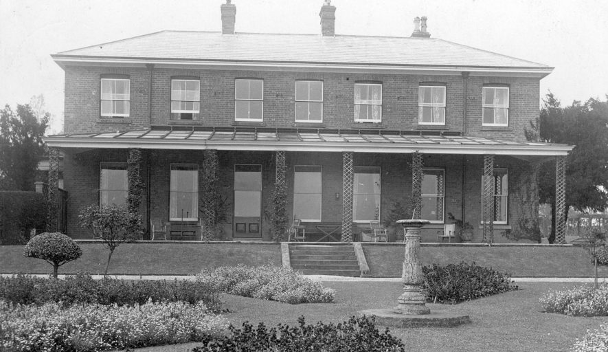 Side view of The Leys, Claverdon showing the formal garden.  1912 |  IMAGE LOCATION: (Warwickshire County Record Office)