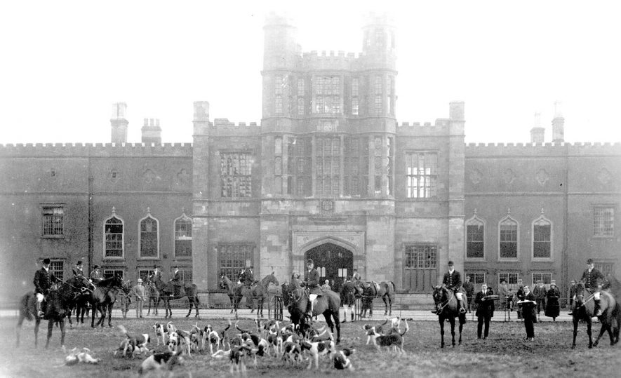Horses and hounds outside Coughton Court. 1920s |  IMAGE LOCATION: (Warwickshire Museums. Photographic Collections.)