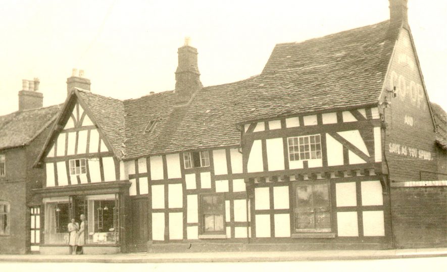 An old timbered Co-op shop in Swan Street, Alcester.  1920s |  IMAGE LOCATION: (Warwickshire Museums. Photographic Collections.)